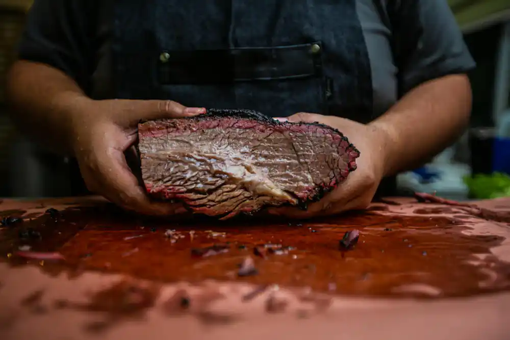 Chef preparing sous vide brisket